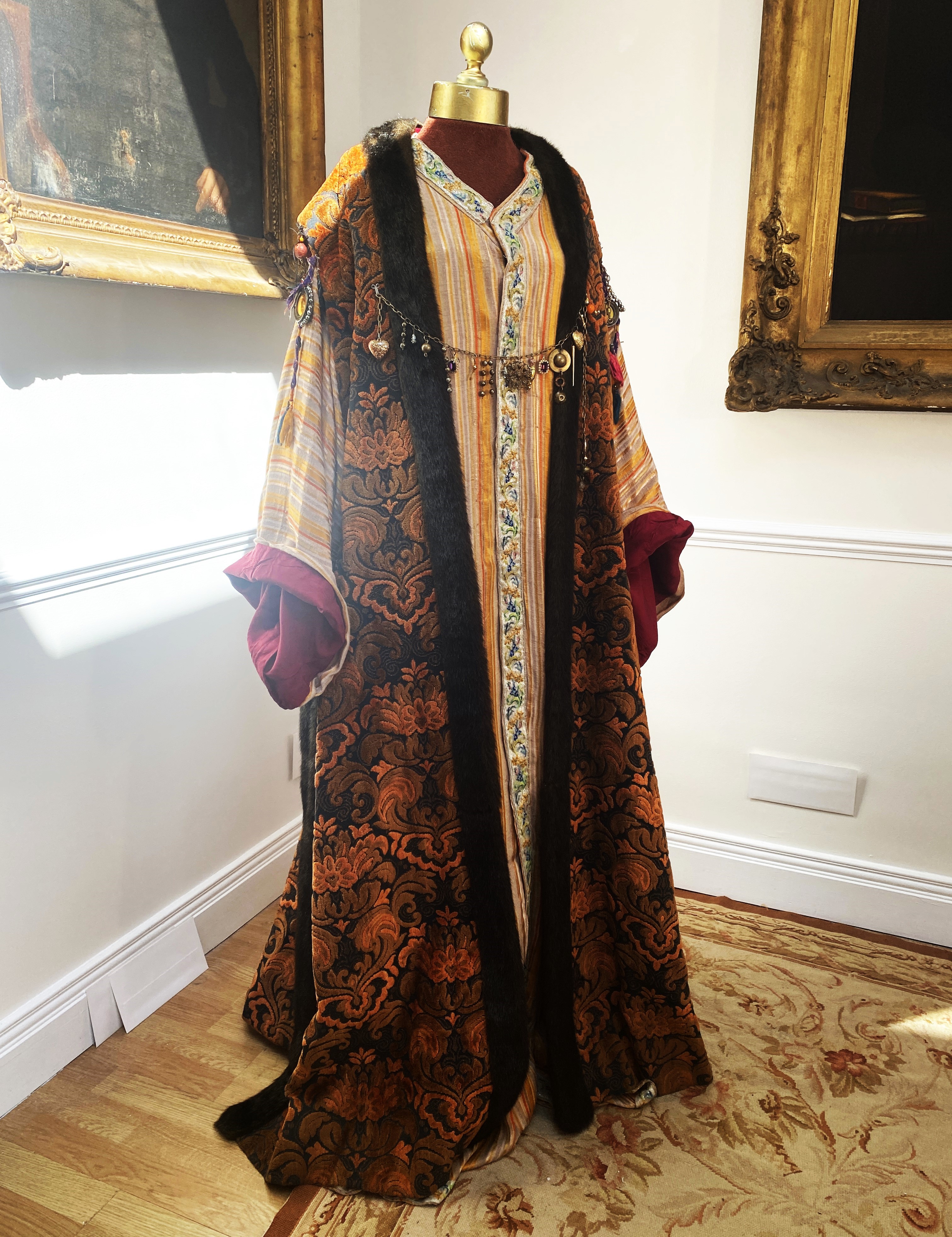 A men’s brocade robe with imitation fur edging and ethnic metal decorations, and orange/black under-garment, labelled Royal Opera House ‘Clamenza di Tito’ – Hebrew Dignity